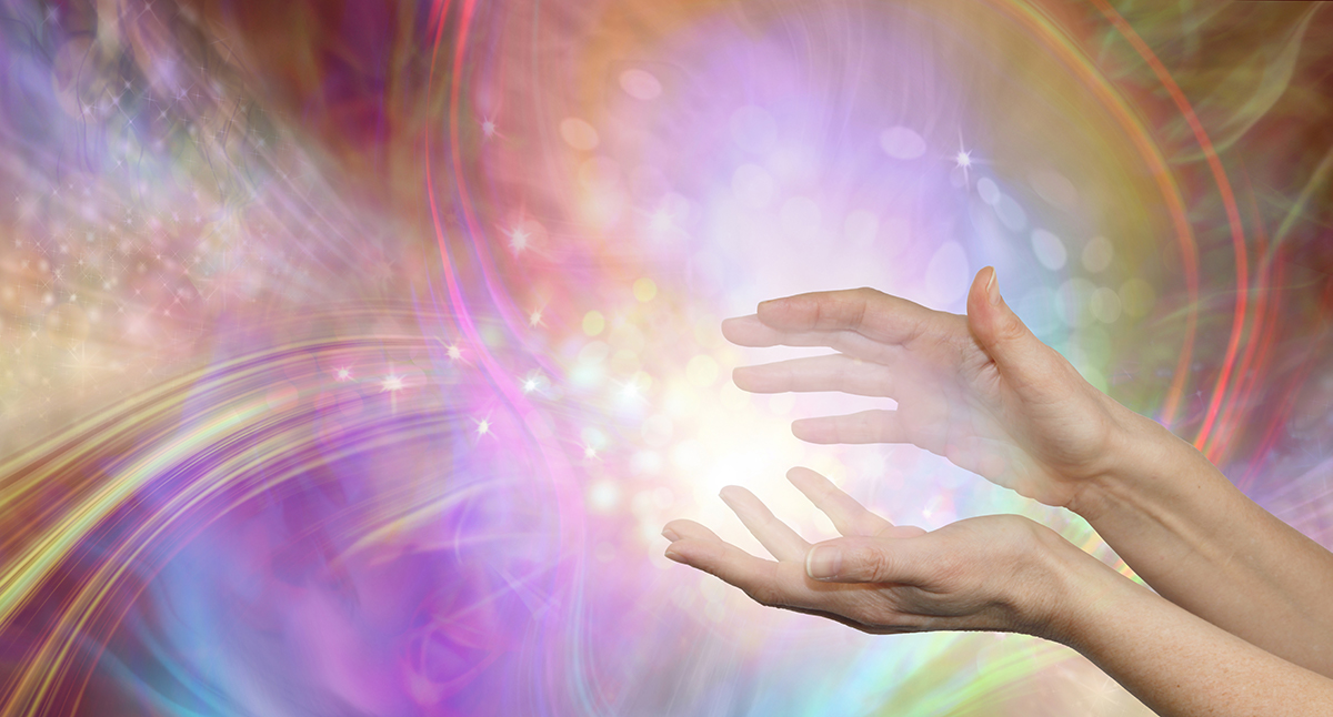 Hands with swirling energy around them