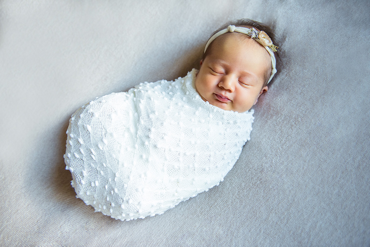 Adorable baby wrapped in cloth