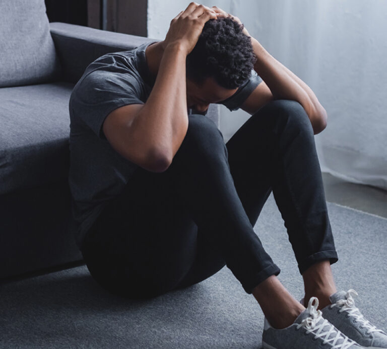 man holding his head in despair