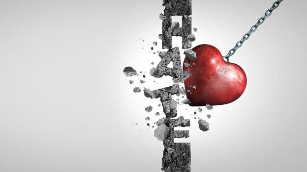 A heart breaking up the letters of Hate