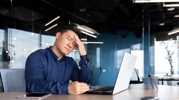 Man holding his head