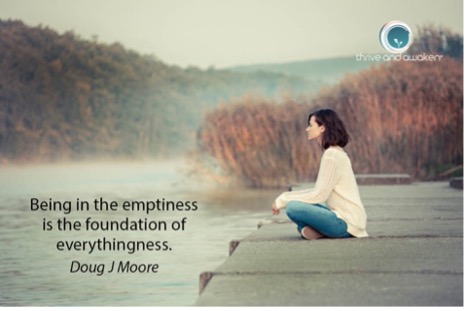 Person sitting on a dock overlooking a lake. Quote from Doug: Being in the emptiness is the foundation of everythingness
